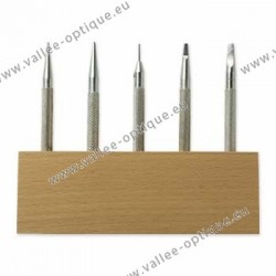 Set of punching tools on wood stand