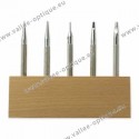 Set of punching tools on wood stand